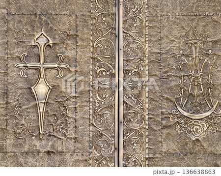 Historic Ornate Door, Weathered Historic Door Featuring Intricate Embossing And Gilded Details Historic Ornate Door, Weathered Historic Door Featuring Intricate Embossing And Gilded Details 136638863