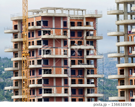 Massive Concrete Residential Blocks With Exposed Cores And Overhead Cranes Dominate Skyline Massive Concrete Residential Blocks With Exposed Cores And Overhead Cranes Dominate Skyline 136638956
