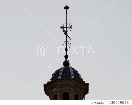 Restoration Technician Observes Atop Ornate Ceramic Cupola Amid Peaceful Dusk Ambiance In City Skyline 136639028