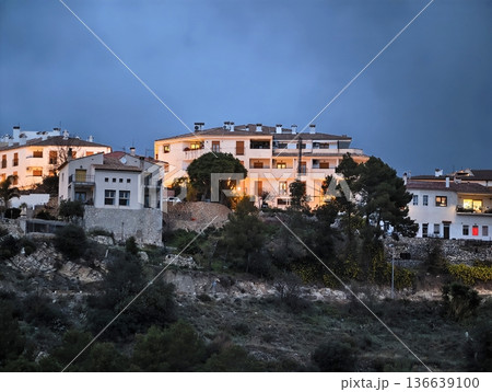 Scenic Mediterranean Settlement Illuminated During Evening With Tranquil Vistas And Terraces Scenic Mediterranean Settlement Illuminated During Evening With Tranquil Vistas And Terraces 136639100