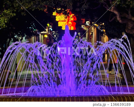 Spectacular Luminous Fountain With Flowing Streams And Vibrant Magenta Accents Illuminating Evening 136639189