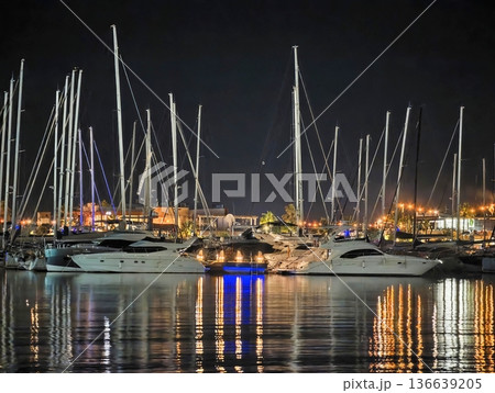 Vibrant Maritime Scene, Boats Rest Under Shimmering Lights, Harbor Filled With Bustling Activity At Night Vibrant Maritime Scene, Boats Rest Under Shimmering Lights, Harbor Filled With Bustling Activity At Night 136639205