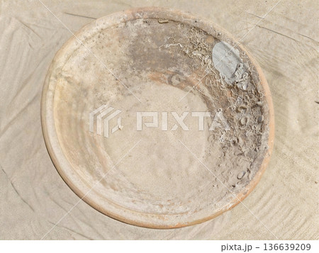 Weathered Bowl Scene, Sunlit Scene Depicting Aged Terracotta Vessel Amidst Shells And Sand At Coast Weathered Bowl Scene, Sunlit Scene Depicting Aged Terracotta Vessel Amidst Shells And Sand At Coast 136639209