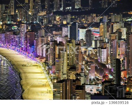 Colorful Cityscape Nighttime, Aerial Shot Of Vibrant Night City With Illuminated Streets And Buildings Colorful Cityscape Nighttime, Aerial Shot Of Vibrant Night City With Illuminated Streets And Buildings 136639516