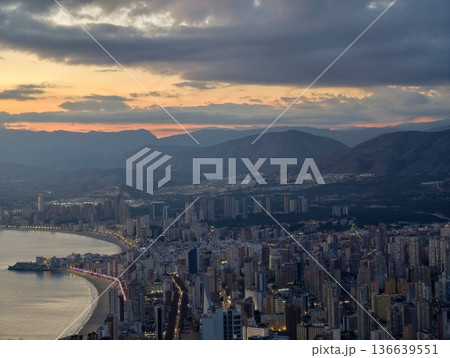 Sunset Mountains Contrast, Serene Landscape Featuring Mountain Silhouettes And Tranquil Sea Under Sunset Glow Sunset Mountains Contrast, Serene Landscape Featuring Mountain Silhouettes And Tranquil Sea Under Sunset Glow 136639551