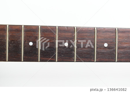 part of brown wood acoustic guitar isolated on white background part of brown wood acoustic guitar isolated on white background 136641082