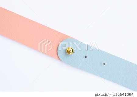 light blue and pink leather strap isolated on white background 136641094