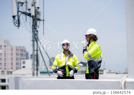 Technician team talking collaboration working about communication transmitter system. 136642574