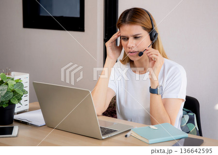 Young caucasian business woman working and meeting online with stress and frustrated. 136642595