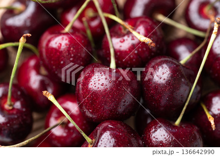 Close-up of fresh red cherries with water droplets texture for background, ripe summer fruit 136642990