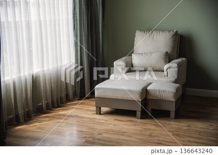 Cozy living room sofa couch home background with copy space. Warm home interior bright simple living space. Home showcase interior light bokeh furniture decor. Home furniture Blurry background Cozy living room sofa couch home background with copy space. Warm home interior bright simple living space. Home showcase interior light bokeh furniture decor. Home furniture Blurry background 136643240