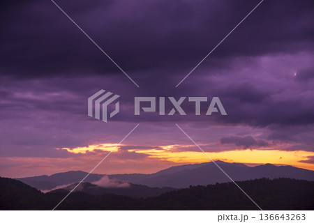 Violet purple sky in morning scenery Vibrant colorful blue sky summer time on sunrise. Natural beautiful landscape. Beauty purple sky romantic dramatic landscape cloudy outdoor paradise in sunset 136643263