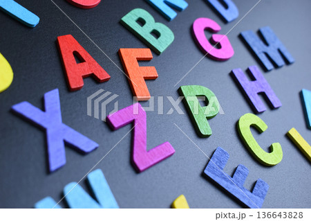 colorful letter alphabet on black background, object for education 136643828