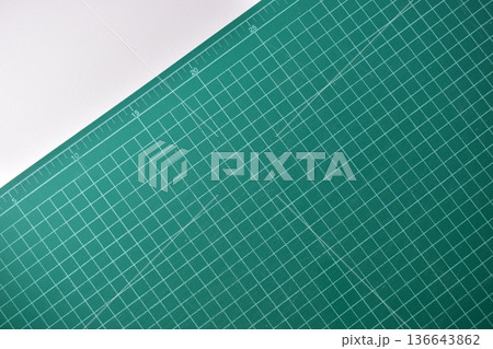 green cutting mat board on white background with line and scale measure guide pattern for art design green cutting mat board on white background with line and scale measure guide pattern for art design 136643862