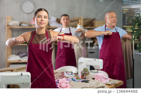 Tailors do a warm-up in the workshop Tailors do a warm-up in the workshop 136644488