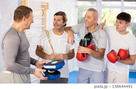 Group of men talking after training in studio Group of men talking after training in studio 136644491