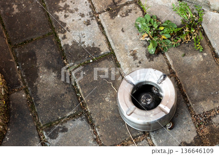 Forgotten smoking spot outdoors. Abandoned outdoor space with water stains and moss growth Forgotten smoking spot outdoors. Abandoned outdoor space with water stains and moss growth 136646109