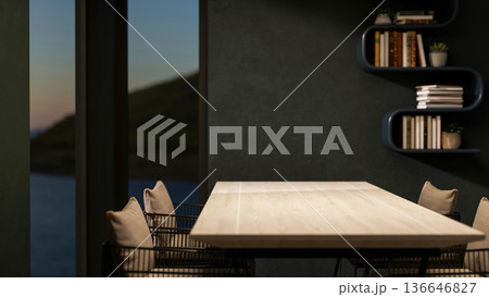 Wooden table with metal chair with glass window and hanging bookshelf on dark green wall in dim room 136646827