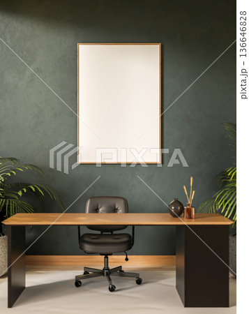 Blank frame on dark green wall over wooden table with swivel chair aside houseplants in office room. 136646828