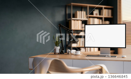 White screen computer and mic with headphones for radio or podcast on wooden table in office studio. White screen computer and mic with headphones for radio or podcast on wooden table in office studio. 136646845