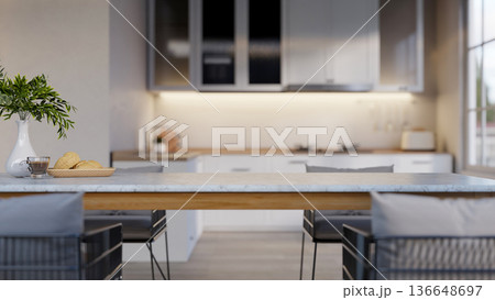 Coffee cup and bread on marble dining table and chairs across kitchen cooking counter under cupboard 136648697