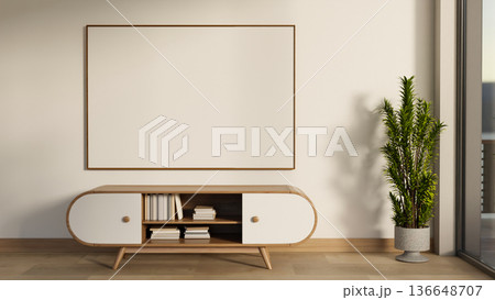White frame on wall over bookshelf drawer table and pot plant on wooden parquet floor in modern room White frame on wall over bookshelf drawer table and pot plant on wooden parquet floor in modern room 136648707