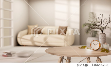 Clock and candle aside vase on round wooden table across sofa in a living room with bright sunlight. Clock and candle aside vase on round wooden table across sofa in a living room with bright sunlight. 136648708