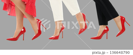 Three women walk in red high heels for a shoe advertisement 136648790