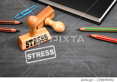 Stress Concept With Stamp And Office Supplies On Chalkboard Background 136649362