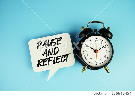 Pause And Reflect text on speech bubble with alarm clock on blue background Pause And Reflect text on speech bubble with alarm clock on blue background 136649454