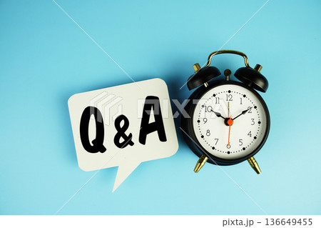 Q & A text on speech bubble with alarm clock on blue background 136649455