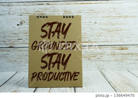 Stay Grounded, Stay Productive Motivational And Inspirational Quotes on wooden background 136649470