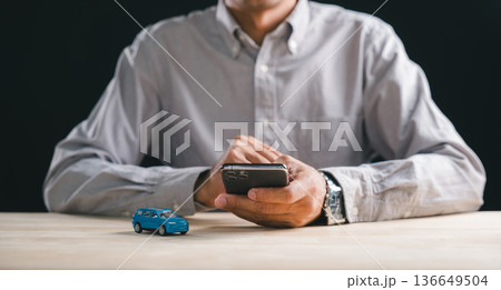 Man holds smartphone, navigating online car marketplace for shopping, comparing auto purchase options, evaluating auto acquisition, modern digital platform for vehicle selection Man holds smartphone, navigating online car marketplace for shopping, comparing auto purchase options, evaluating auto acquisition, modern digital platform for vehicle selection 136649504