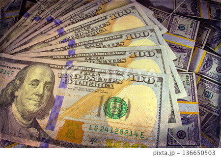 Vintage Style Stack of US Hundred Dollar Bills. A textured, old-photo effect overlaying a pile of $100 American banknotes, highlighting financial concepts and wealth. Vintage Style Stack of US Hundred Dollar Bills. A textured, old-photo effect overlaying a pile of $100 American banknotes, highlighting financial concepts and wealth. 136650503