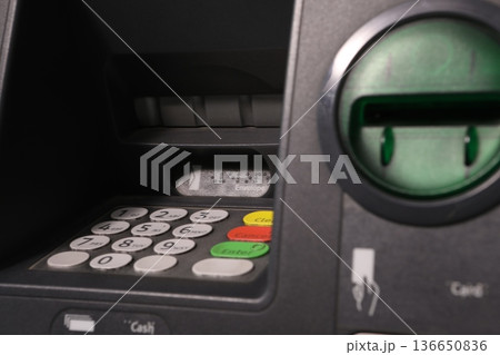 Closeup of a ATM machine 136650836