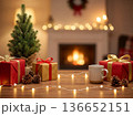 Christmas gifts and mug on wooden table against cozy fireplace background 136652151