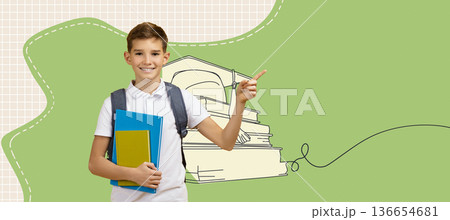 A schoolboy stands against a bright background holding textbooks and a backpack. He is pointing to the side as if showing or suggesting something. The scene is active and lively. 136654681