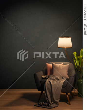 Sofa chair with cushion and blanket under lamp light on wooden parquet floor aside wall in dim room. 136654888