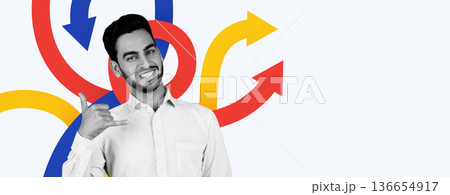 A man is smiling and making a hand gesture in front of a background featuring colorful arrows. The design is modern and simplistic, conveying a sense of energy and movement. 136654917