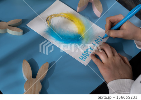 Making Easter egg from cotton rope and feather Gift Easter idea. Do it yourself instruction postcard eco-friendly decoration. Making handmade art presents children's diy projects. Spring holiday 136655233