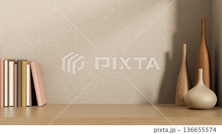 Various design flower vases and books on wooden counter table with sunlight shining on beige loft wall. 136655574