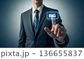 Businessman Pointing at Glowing Big Data Button on Virtual Interface 136655837