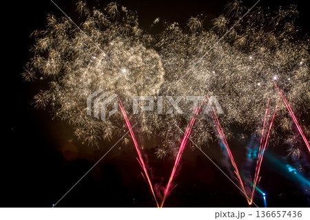 The colorful light of fireworks at Munich Olympiapark, Germany The colorful light of fireworks at Munich Olympiapark, Germany 136657436