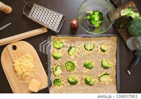 Ingredients for smashed broccoli with cheese are on dark kitchen table Ingredients for smashed broccoli with cheese are on dark kitchen table 136657981