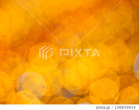 Abstract Bokeh from indoor lighting, Blue with orange with gold and yellow circles spread on black colored surface, Night city light background for celebration of christmas and holiday season Abstract Bokeh from indoor lighting, Blue with orange with gold and yellow circles spread on black colored surface, Night city light background for celebration of christmas and holiday season 136659914
