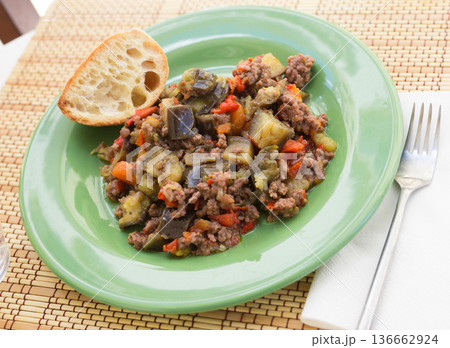 dish of vegetable stew. stewed eggplant, minced meat, carrots, peppers, onion squid dish of vegetable stew. stewed eggplant, minced meat, carrots, peppers, onion squid 136662924
