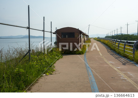 Bicycle path along the Geumgang River 136664613