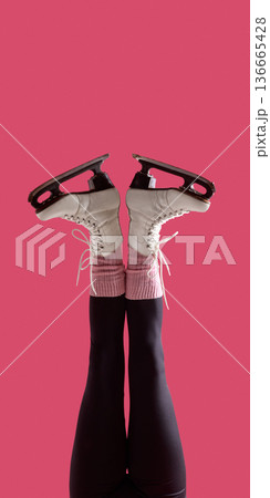 Female legs in white figure skates symmetrical pose on pink background. 136665428