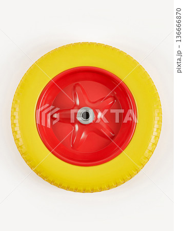 Wheel is pneumatic on a white background. Yellow rubber, red disc. 136666870