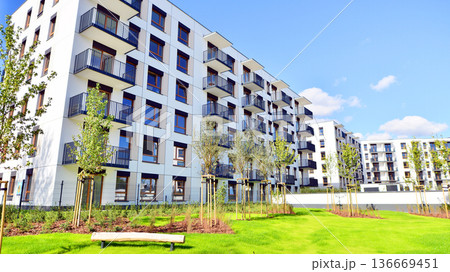 Residential building. bottom view. Modern apartment building on a sunny day. Facade of a modern apartment building. Residential building. bottom view. Modern apartment building on a sunny day. Facade of a modern apartment building. 136669451